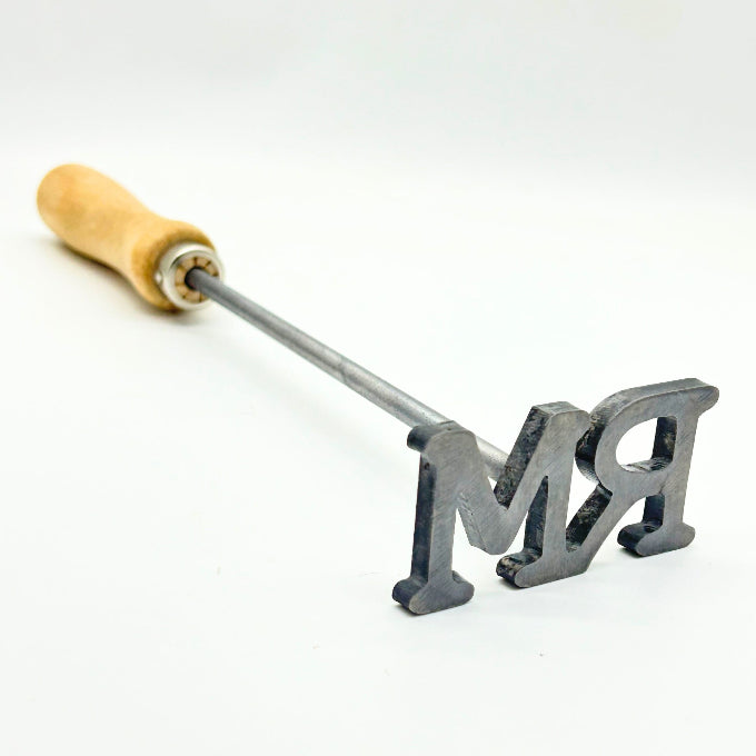 2 letter fire heated branding iron - Hot Branding Close Up