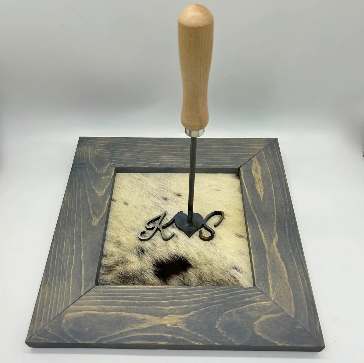 Branding Iron on cowhide wedding frame.