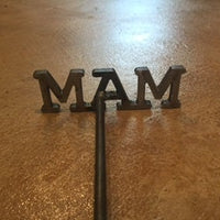 3 Letter Close Up of Branding Iron