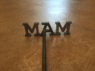 3 Letter Close Up of Branding Iron