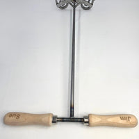 Full picture of wedding brander.Shows the engraved handles with bride and groom names, 24 rod coming downto the brand.