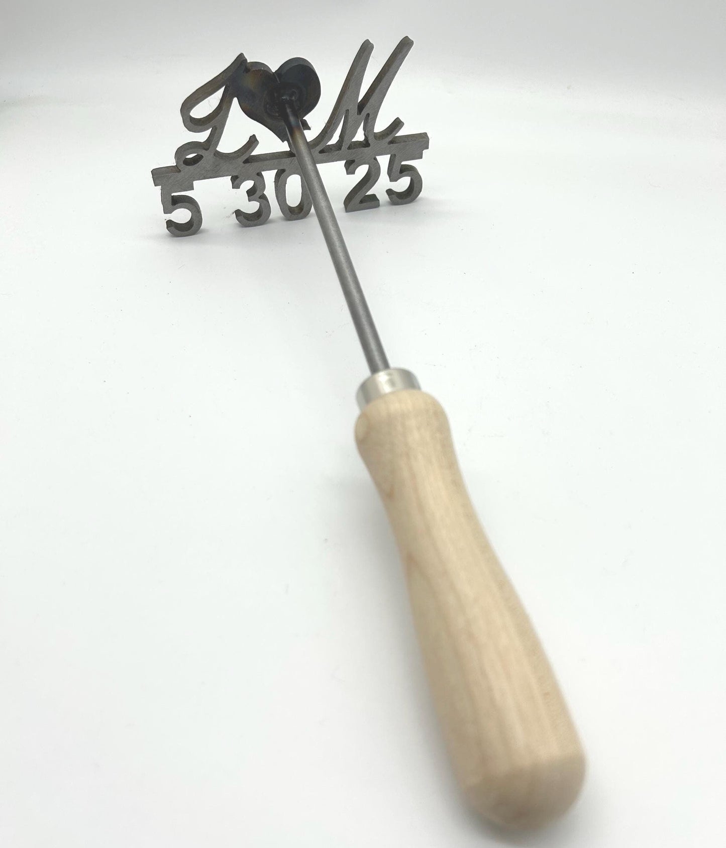 wedding Branding Iron with first initials in script and heart in the middle. below that is the wedding date. impeccable craftsmanship.
