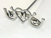 Three letter wedding branding iron with horseshoes on both sides and a heart in the middle. The letters are centered within heart and both horseshoes.