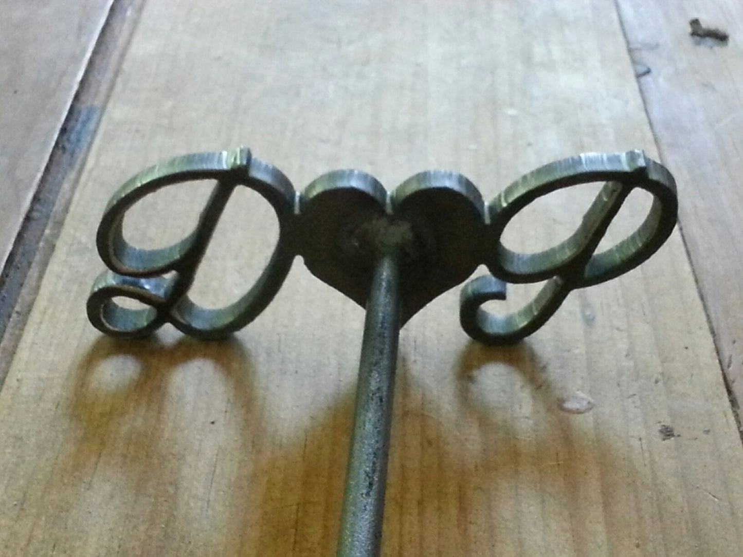 Close up Branding Iron - First initial with a heart in the center and then the last initial. 12" long. For anniversaries, weddings, and BBQ
