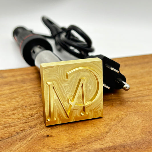 Brass Branding Irons with CM initials and heating element.