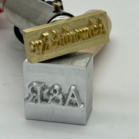 2 inch ice stamp with 'A&R' text. High precision machining
