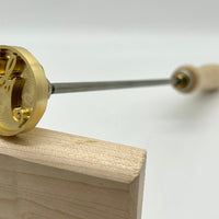 Manual Handle Brass Head Closeup of Stamp.
