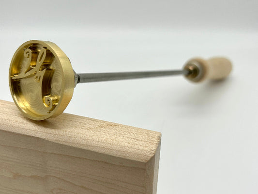 Manual Handle Brass Head Closeup of Stamp.