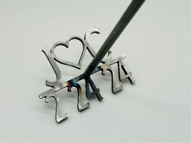Displays the branding iron length at 6 inches The height is 24 inches. Close up of the brand, double handle for bride and groom as well as the engraved text on the each handle of bride and groom names.